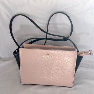 Small pink and black Kate Spade crossbody bag.